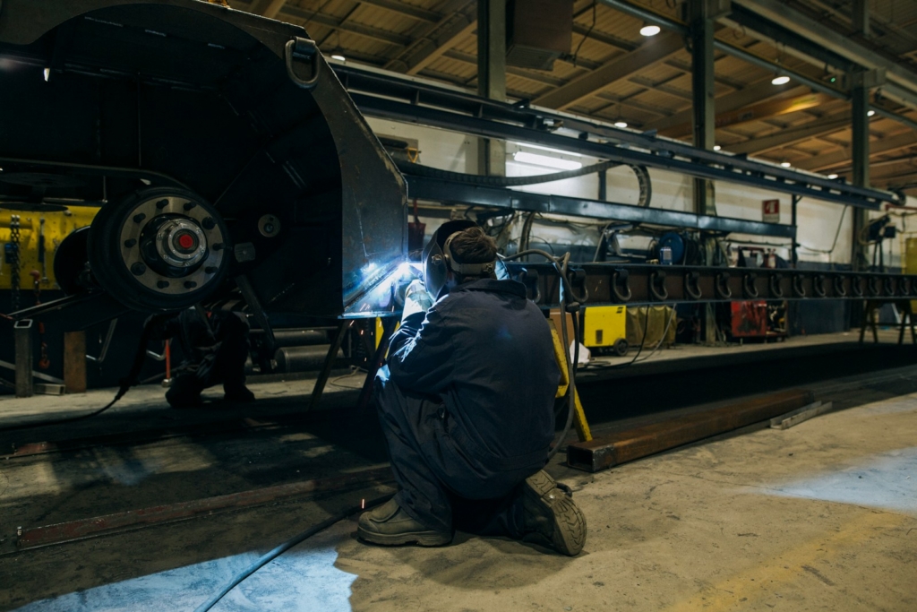 a man working on a machine in a factory